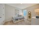 Small bedroom with daybed and decorative wall art at 4519 Boxelder Avenue, Parrish, FL 34219
