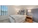 Cozy bedroom with a full-size bed and stylish decor at 4519 Boxelder Avenue, Parrish, FL 34219