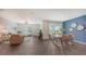Open concept dining and living room with hardwood floors at 4519 Boxelder Avenue, Parrish, FL 34219