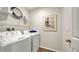 Laundry room with washer, dryer, and overhead shelving at 4519 Boxelder Avenue, Parrish, FL 34219