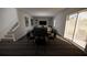 Open concept living and dining area with dark hardwood floors at 4523 Boxelder Avenue, Parrish, FL 34219