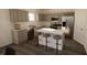 Modern kitchen with stainless steel appliances and an island at 4523 Boxelder Avenue, Parrish, FL 34219