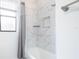 Clean bathroom featuring a bathtub and marble tile at 4814 Sparkling Sea Ln, Lakewood Ranch, FL 34211