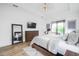 Relaxing bedroom with sliding glass doors leading to a balcony at 4814 Sparkling Sea Ln, Lakewood Ranch, FL 34211