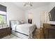 Well-lit bedroom with a queen bed and walk-in closet at 4814 Sparkling Sea Ln, Lakewood Ranch, FL 34211