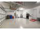 Spacious garage with overhead storage and epoxy floor at 4814 Sparkling Sea Ln, Lakewood Ranch, FL 34211