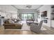Spacious living area with fireplace and access to backyard at 4814 Sparkling Sea Ln, Lakewood Ranch, FL 34211