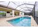 Inviting pool and spa with covered patio and seating at 4814 Sparkling Sea Ln, Lakewood Ranch, FL 34211