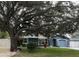 Charming house with a spacious front yard, large tree, and landscaped lawn at 5303 14Th Avenue W Dr, Bradenton, FL 34209