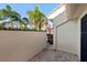 Small patio area with brick flooring and exterior wall at 5343 Huntingwood Ct # 33, Sarasota, FL 34235