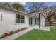 Home exterior featuring manicured landscaping, walkway and access to backyard patio at 5429 Potter St, Sarasota, FL 34232