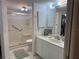 Bathroom with walk-in shower, toilet and vanity at 5725 Greenwood Ave # 9103, North Port, FL 34287