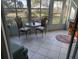 Bright sunroom with seating area and view of backyard at 5725 Greenwood Ave # 9103, North Port, FL 34287