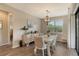 Bright dining room featuring a white table and chairs at 5931 Caspian Tern Dr, Sarasota, FL 34238