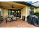 Covered patio with brick pavers, seating area, and grill at 5931 Caspian Tern Dr, Sarasota, FL 34238