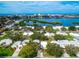 Aerial view of waterfront community, showcasing houses and canal at 5940 Driftwood Ave # 15, Sarasota, FL 34231