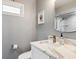 Bathroom with marble countertop, modern fixtures, and shower at 5940 Driftwood Ave # 15, Sarasota, FL 34231