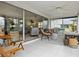 Spacious Florida room with sliding glass doors and view of the backyard at 5940 Driftwood Ave # 15, Sarasota, FL 34231