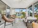 Bright and airy Florida room with comfortable seating and backyard views at 5940 Driftwood Ave # 15, Sarasota, FL 34231