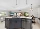 Kitchen island with sink, dishwasher, and plenty of counter space at 5940 Driftwood Ave # 15, Sarasota, FL 34231