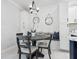 Charming kitchen nook with built-in bench seating and a round table at 5940 Driftwood Ave # 15, Sarasota, FL 34231