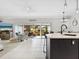 Living room with open floor plan and view of patio at 5940 Driftwood Ave # 15, Sarasota, FL 34231