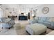 Open living room and kitchen with light color palette at 5940 Driftwood Ave # 15, Sarasota, FL 34231