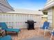 Relaxing patio with seating, grill, and brick pavers at 5940 Driftwood Ave # 15, Sarasota, FL 34231