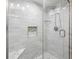 Large, updated shower with glass enclosure and marble seat at 5940 Driftwood Ave # 15, Sarasota, FL 34231