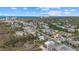 Aerial view of beach house with ocean view, surrounded by other homes and beach at 600/602 Beach Rd # 1 & 2, Sarasota, FL 34242