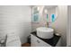 Small bathroom with pedestal sink and toilet at 600/602 Beach Rd # 1 & 2, Sarasota, FL 34242