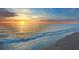 Stunning sunset over a serene beach with gentle waves at 600/602 Beach Rd # 1 & 2, Sarasota, FL 34242