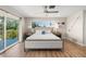 Main bedroom with a king-size bed and ocean views at 600/602 Beach Rd # 1 & 2, Sarasota, FL 34242