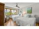 Guest bedroom with two twin beds, hardwood floors, and beach views at 600/602 Beach Rd # 1 & 2, Sarasota, FL 34242