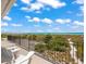 Relaxing oceanfront deck featuring white chairs and stunning views at 600/602 Beach Rd # 1 & 2, Sarasota, FL 34242