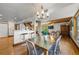 Modern dining area with metal table and chairs, hardwood floors at 600/602 Beach Rd # 1 & 2, Sarasota, FL 34242
