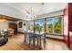 Bright dining area with metal table and chairs, hardwood floors at 600/602 Beach Rd # 1 & 2, Sarasota, FL 34242