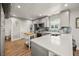 Modern kitchen with stainless steel appliances and white quartz countertops at 600/602 Beach Rd # 1 & 2, Sarasota, FL 34242