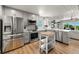 Updated kitchen featuring stainless steel appliances and wood-look flooring at 600/602 Beach Rd # 1 & 2, Sarasota, FL 34242