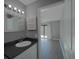 Bathroom with dark countertop, white sink and vanity at 6262 142Nd N Ave # 805, Clearwater, FL 33760