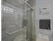 Bathroom with gray tile, glass shower, and modern fixtures at 6262 142Nd N Ave # 805, Clearwater, FL 33760