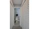 Clean bathroom with toilet and shower visible from hallway at 6262 142Nd N Ave # 805, Clearwater, FL 33760