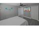 Bedroom with large TV and en-suite bathroom at 6262 142Nd N Ave # 805, Clearwater, FL 33760