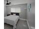 Bright bedroom with a queen bed and ceiling fan at 6262 142Nd N Ave # 805, Clearwater, FL 33760