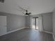 Bedroom with sliding door leading to patio and ceiling fan at 6262 142Nd N Ave # 805, Clearwater, FL 33760