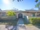 Inviting exterior of condo with landscaped grounds and walkway at 6262 142Nd N Ave # 805, Clearwater, FL 33760