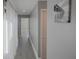 Bright hallway with light gray walls and wood-look flooring at 6262 142Nd N Ave # 805, Clearwater, FL 33760