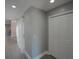 Gray hallway with white doors and wood-look flooring at 6262 142Nd N Ave # 805, Clearwater, FL 33760
