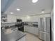 Updated kitchen with stainless steel appliances and gray cabinets at 6262 142Nd N Ave # 805, Clearwater, FL 33760