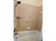 Shower/tub combo with tile surround and grab bar at 636 Lakescene Drive Dr, Venice, FL 34293